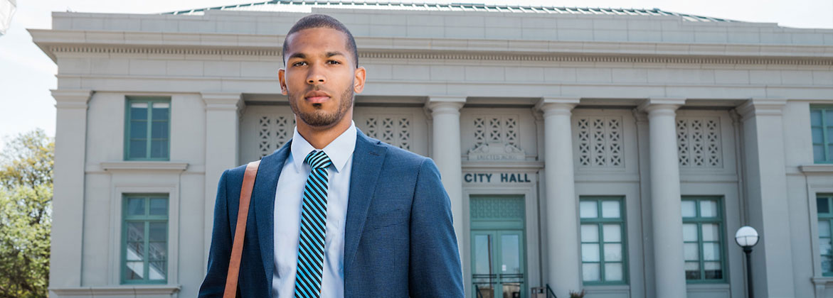 criminal justice professional standing outside Waxahachie's City Hall