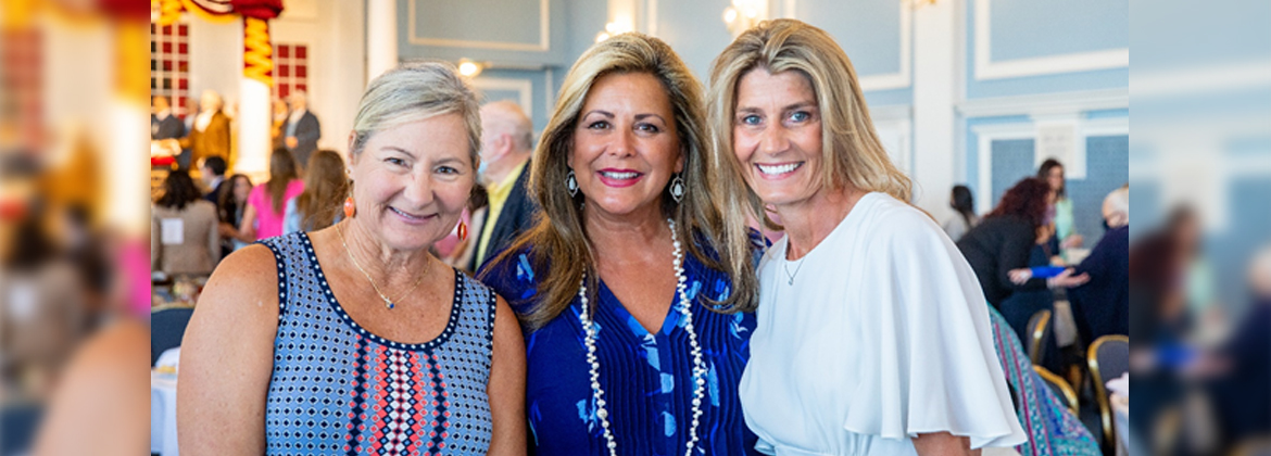 women standing with the Ruth award