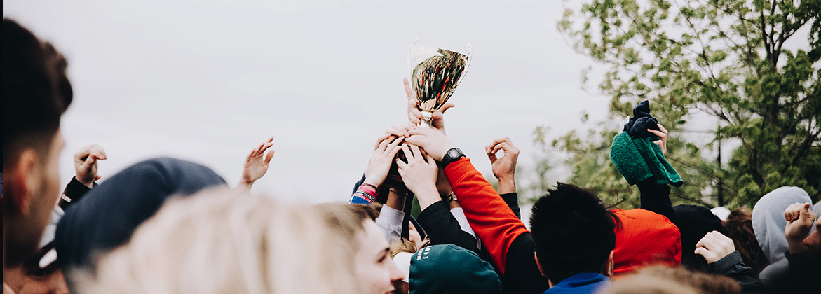 Students holding up a trophy