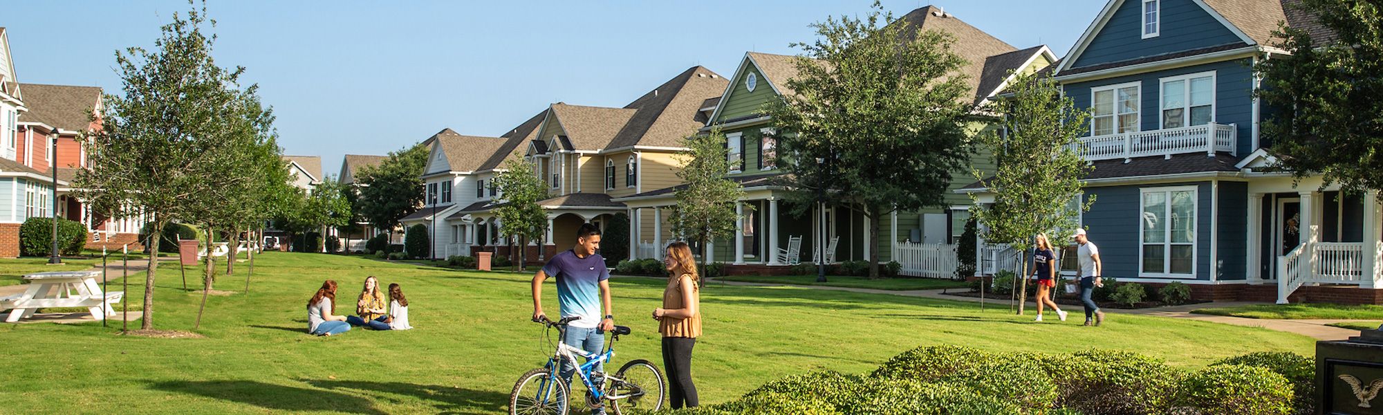 Students mingle in the courtyard of the Townhomes