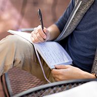 Student taking notes