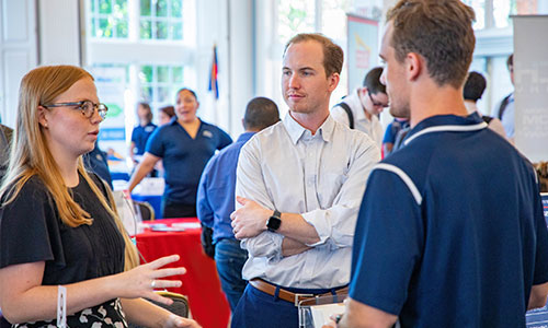 picture of people talking at the DBU job fair