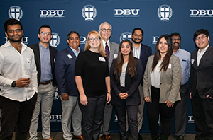 group of DBU alumni standing together at a Dallas business networking event