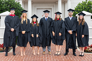 Christian college students in Texas standing outside in front of a college campus building