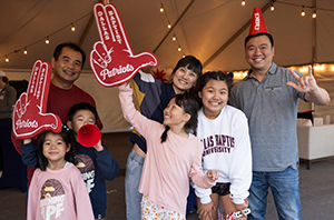 dbu alumni at homecoming with their families