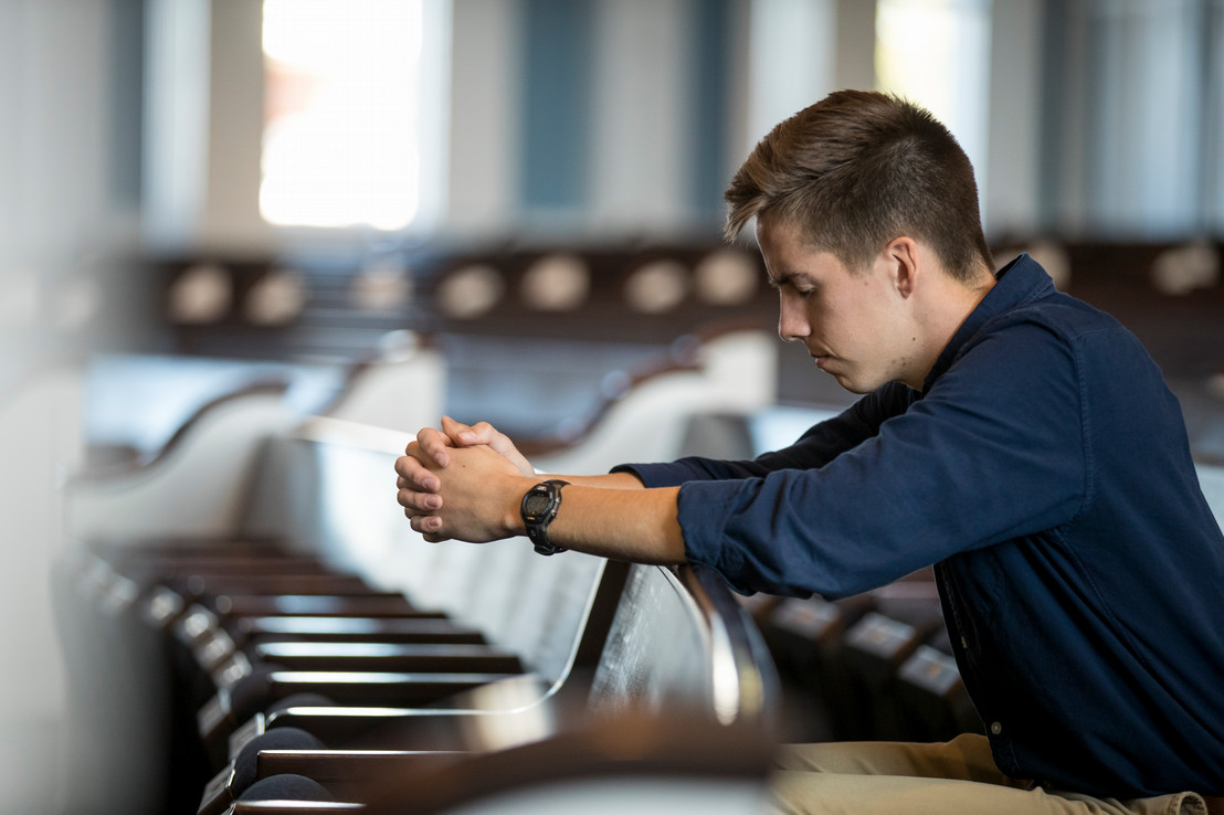 college student praying in Dallas, Texas