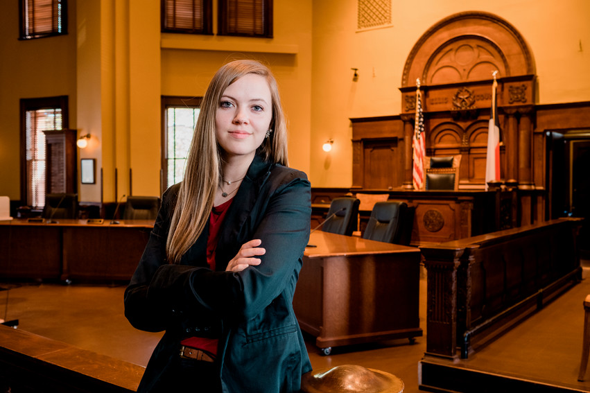 College student standing in courtroom located in Dallas, Texas