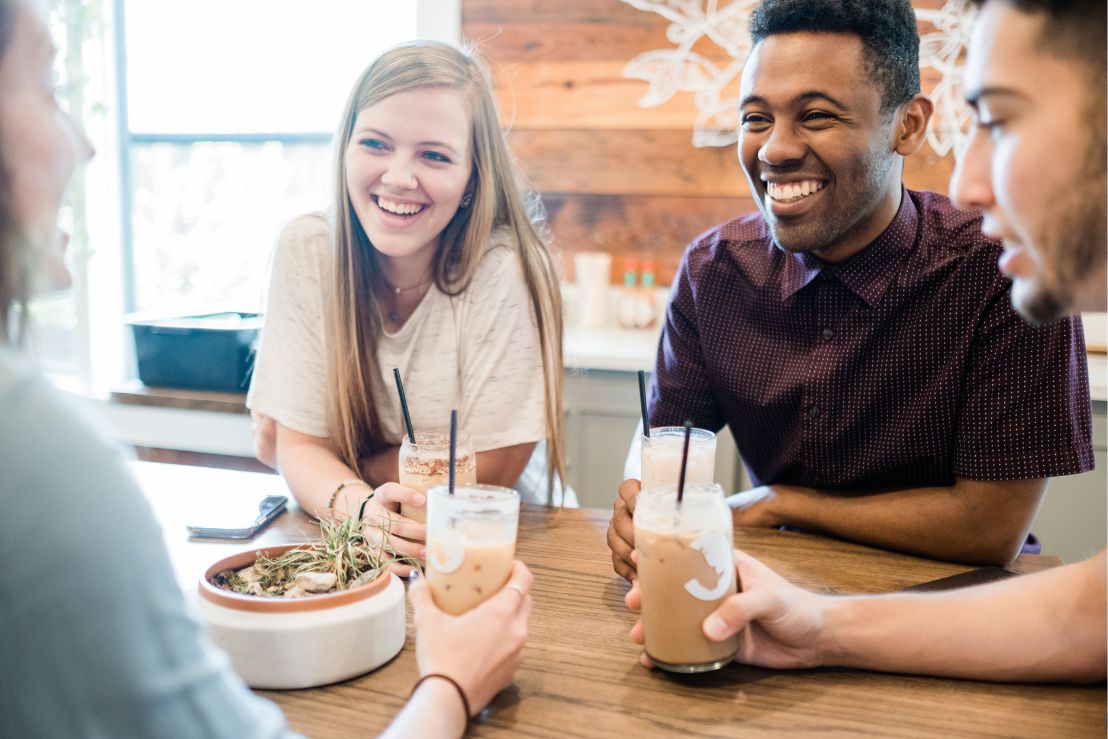 group of college students having fun and drinking coffee in Waxahachie, Texas