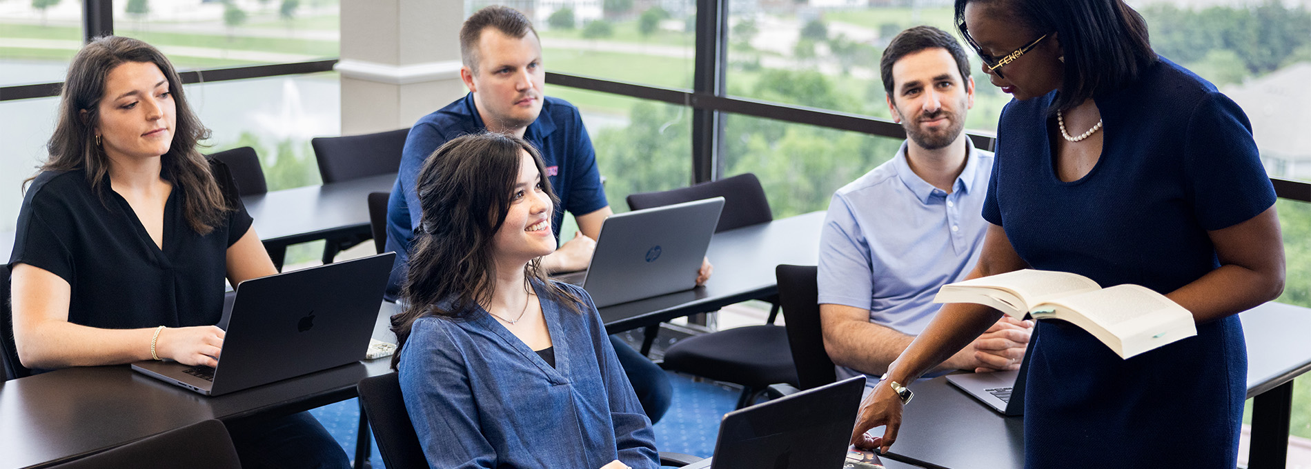 DBU business students in class with DBU business professor