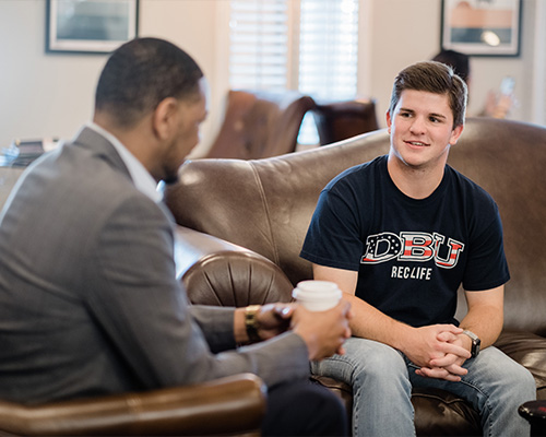 Students talking with advisor