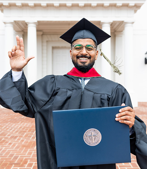 DBU graduate standing and holding his degree