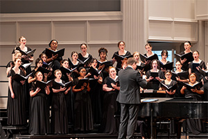 The choir captivates a large audience with their harmonious melodies