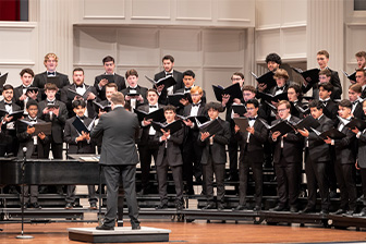 Choral group singing on a stage