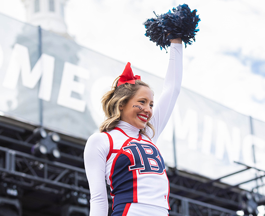 DBU Alumni Events - Cheerleader at Tailgate