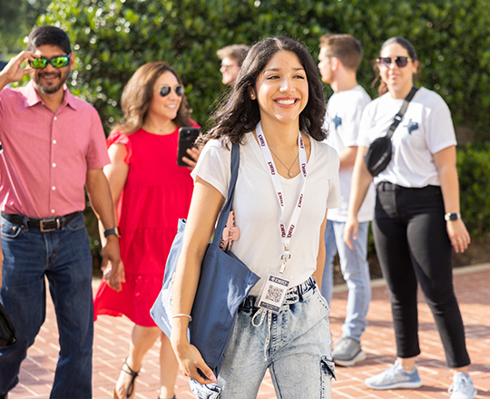 student walking outside chapel