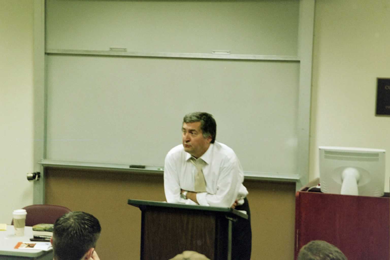 picture of Paul Marshall leaning against the podium speaking