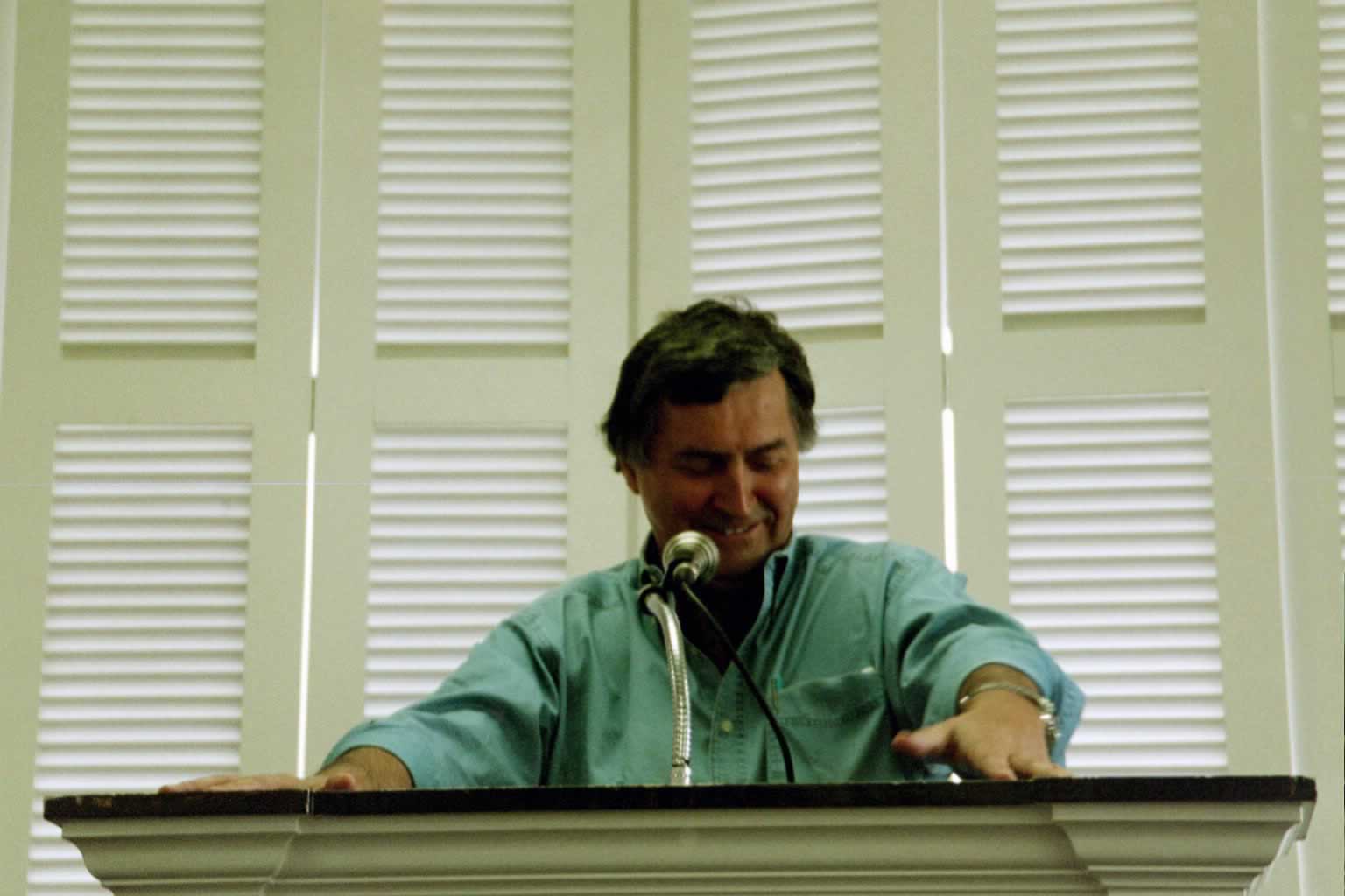 picture of Paul Marshall smiling in front of a podium