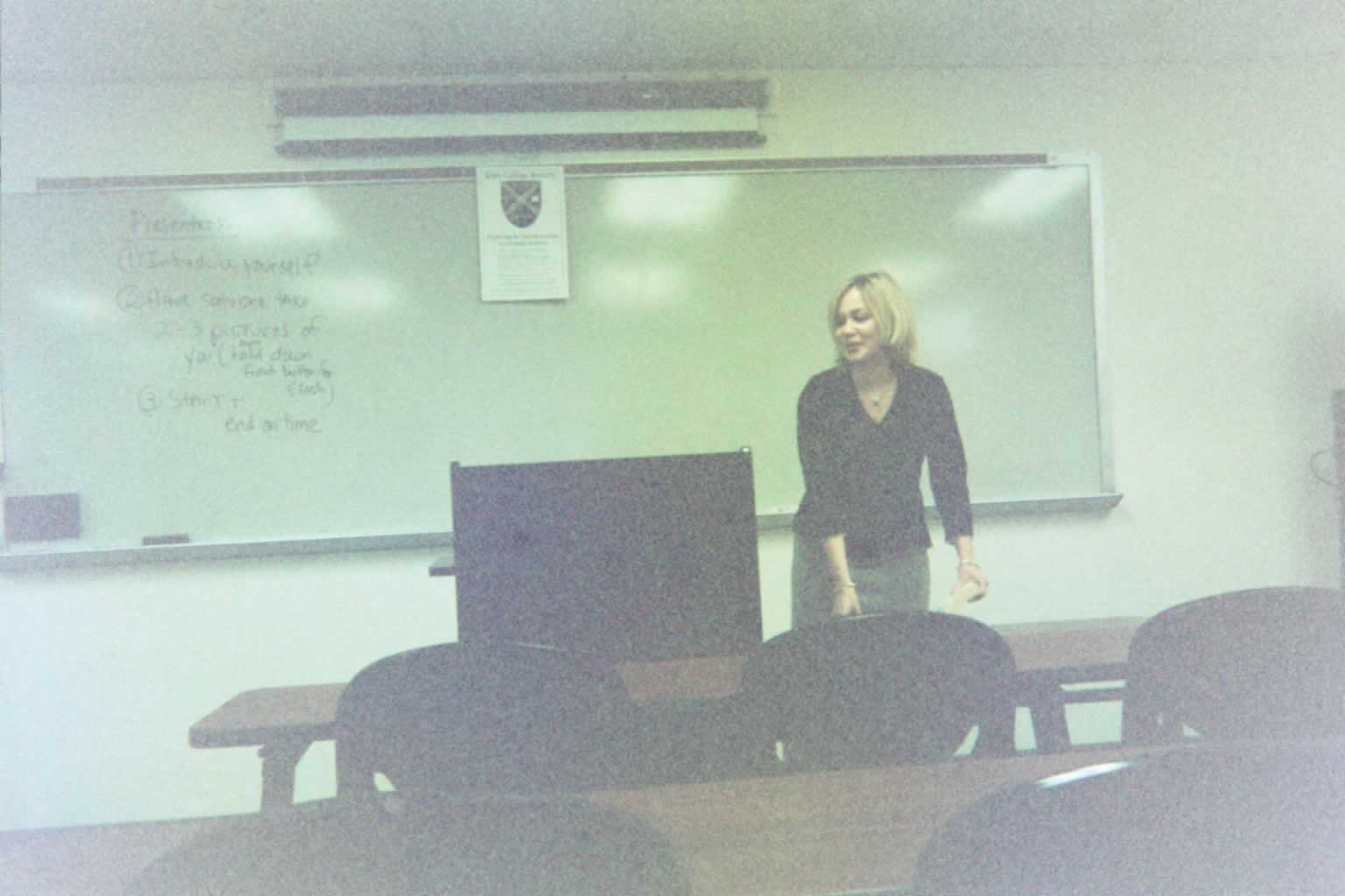 picture of a woman standing next to the podium