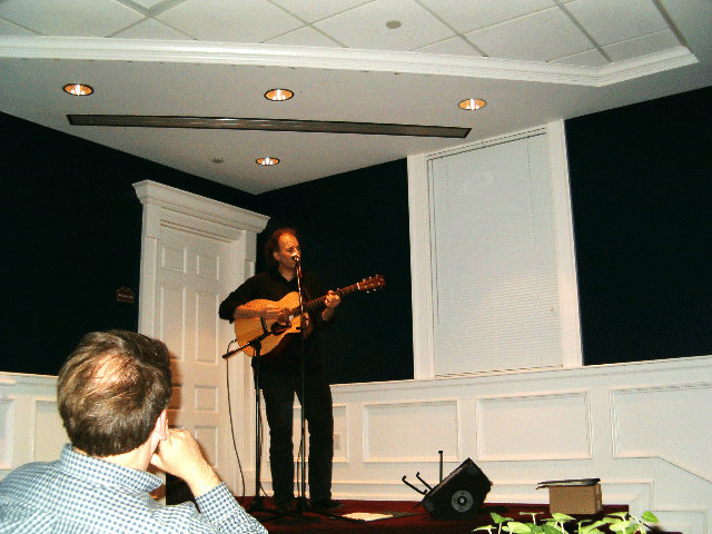 Brooks Williams playing a guitar