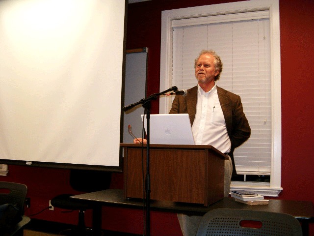 picture of Dr. Steve Garber standing behind a podium speaking