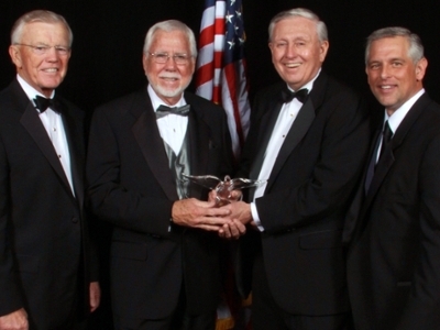 Dallas Baptist University hosted the 24th Annual Russell H. Perry Free Enterprise Dinner on Monday, November 7 at the Anatole Hotel in Dallas. Pictured: Joe Gibbs, dinner speaker; Norm Miller, 2011 recipient of the Russell H. Perry Free Enterprise Award; Boone Powell, Jr., honorary chair of the dinner committee; and Mike Arnold, chair of the dinner committee.