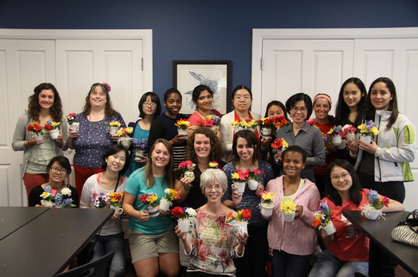 DBU International students display their floral arrangements before taking them to the nursing home.