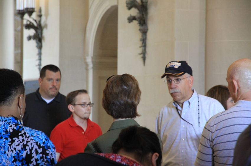 DBU Doctoral Students visit with Captain Doug Rau, a DBU Ph.D. graduate, at the U. S. Naval Academy