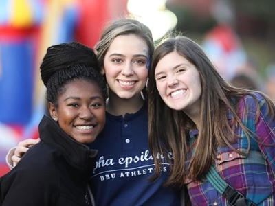 Current DBU students Elon Bohanan, Caroline Walker, & Hannah Baker enjoy the Tailgate Party before the big game