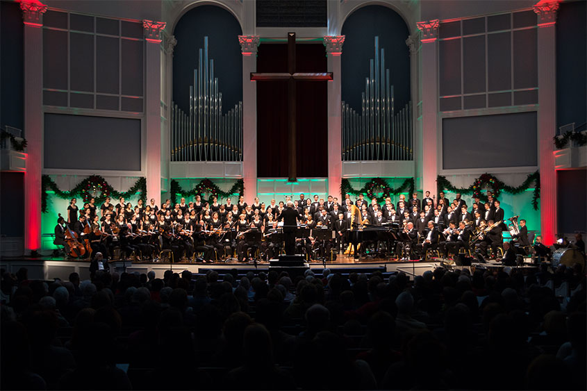 the grand chorus on the chapel stage performing