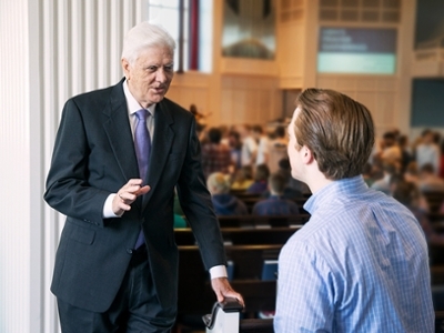 Dr. Daehnert encourages one of his students before chapel