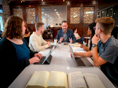 people sitting at a table in coffeehouse