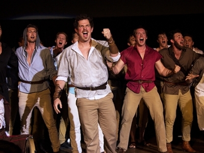 A fraternity performs in front of the crowd