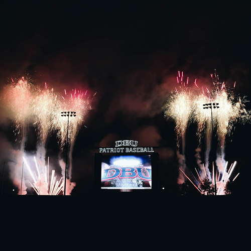 DBU Baseball scoreboard at night with fireworks in the background