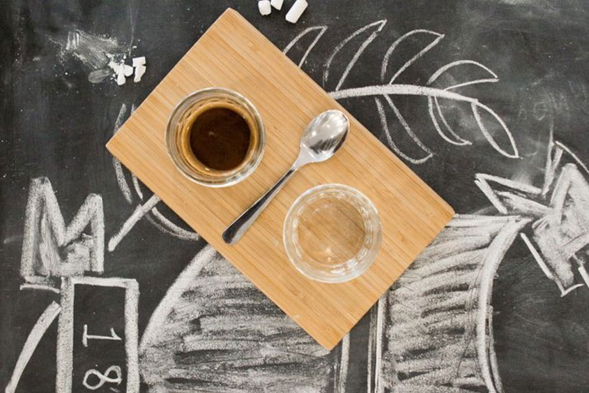 Coffee sitting on a tray on the chalk table in the DBU coffeehouse