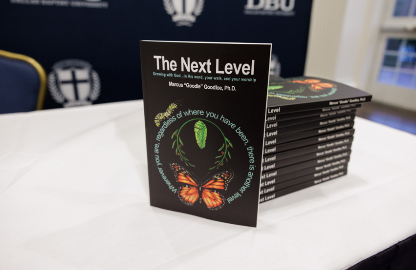 picture of Dr. Marcus Goodloe's book: The Next Level on table