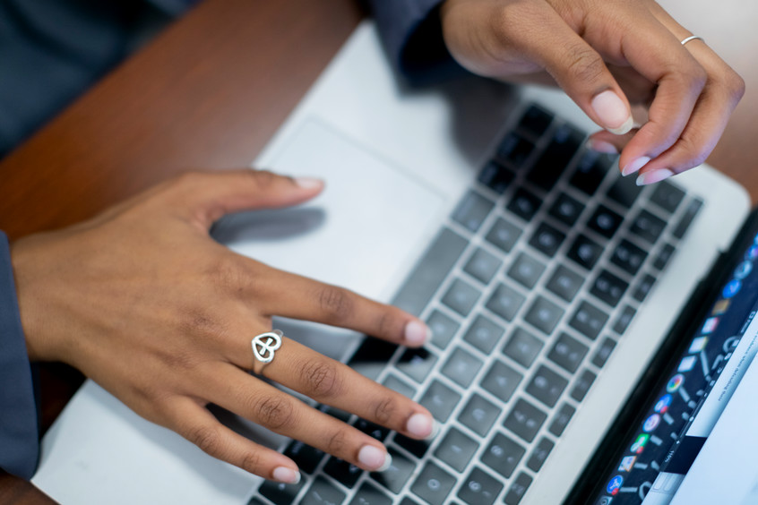 college girl working on coursework on her laptop in Dallas, Texas