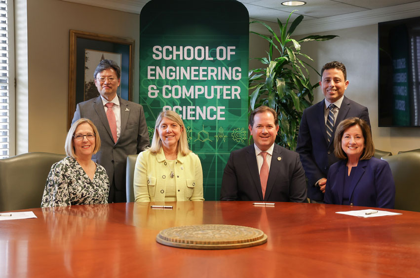 Baylor University and Dallas Baptist University officials sign agreement on Baylor's campus in Waco