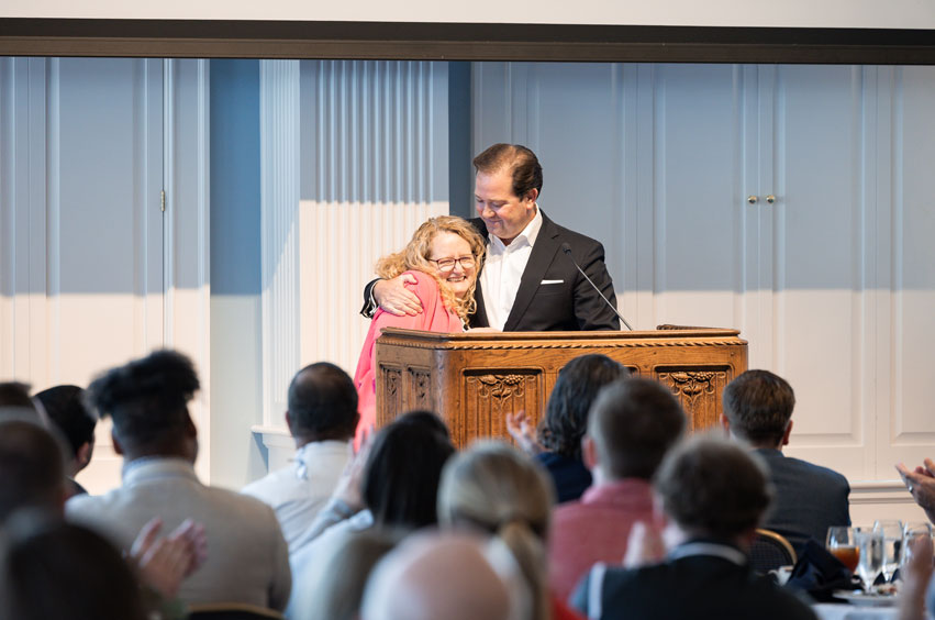 Susie Cassel receiving the award for Staff Member of the Year from DBU President Dr. Adam C. Wright in the Hillcrest Great Hall on the DBU Campus