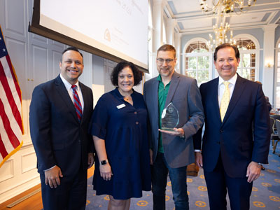 Co-founders of OurCalling Pastor Wayne Walker and Carolyn Walker with Desi Henk and President Adam Wright on DBU's campus in Dallas