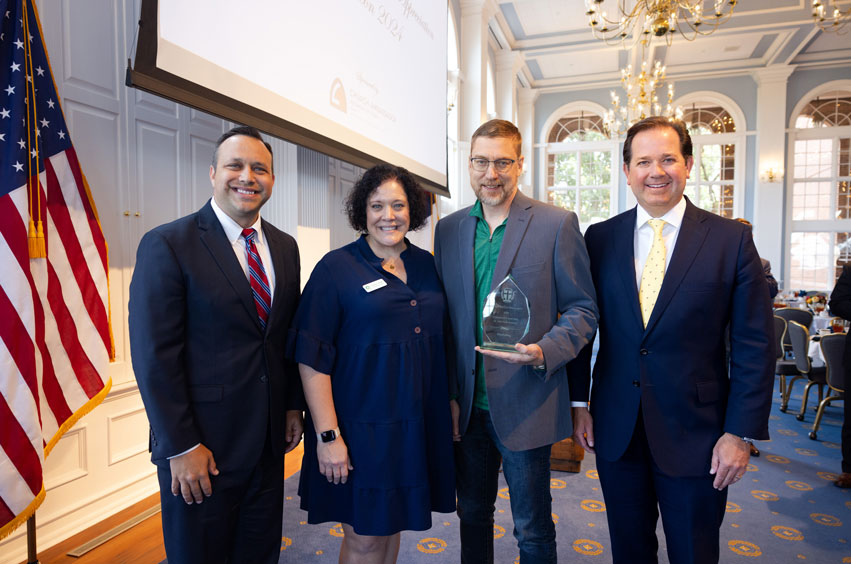 Co-founders of OurCalling Pastor Wayne Walker and Carolyn Walker with Desi Henk and President Adam Wright on DBU's campus in Dallas