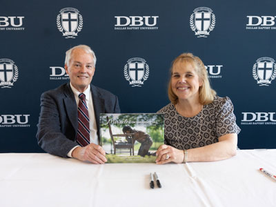 Dr. Mary Nelson and Dr. Gary Cook debuting the new book "Miracles on University Hill" in the Great Hall on the DBU campus in Dallas