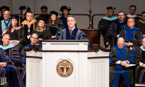 Dr. Willis speaking delivering commencement speech