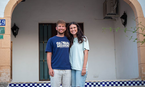 Shelby standing with her husband, Tyler