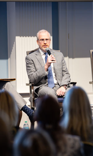 picture of David J. Cramer sitting down and speaking