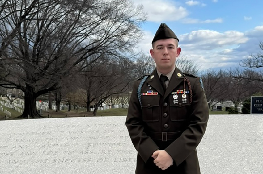 Cadet Herndon standing in uniform outside