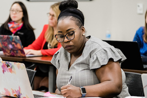 student taking notes in class 