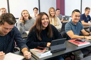 students smiling in classroom 