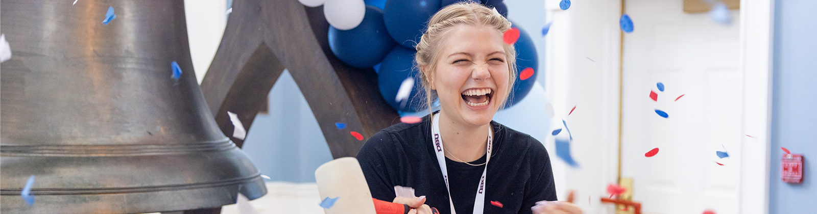 girl celebrates after ringing bell